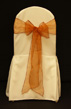 7 IVORY CHAIR COVER & BURNT ORANGE ORGANZA BOW